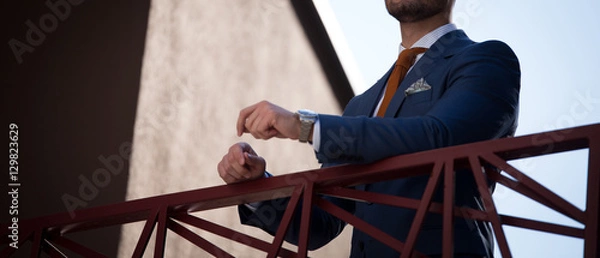 Obraz Male model in a suit posing up close