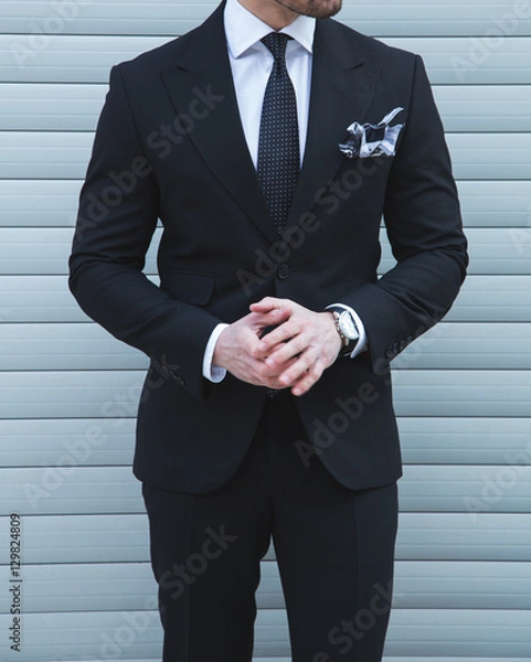 Obraz Male model posing in a black suit