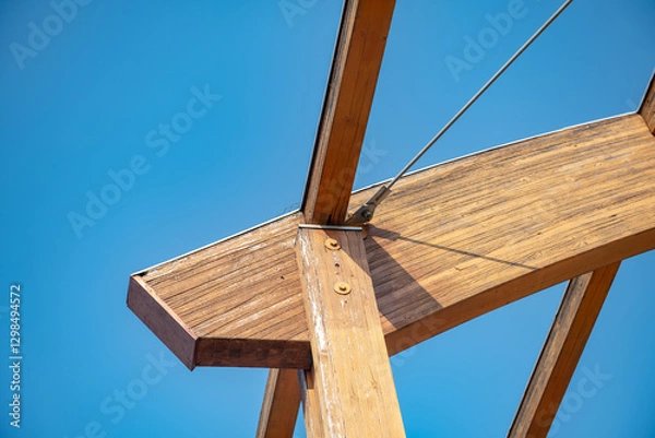 Fototapeta glulam with signs of wear due to time and weather. structure with arched beams and supporting pillars. commercial building designed with structural exposed modules. project, glued laminated timber