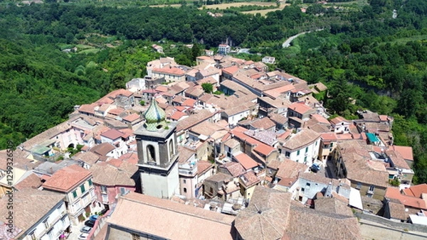 Fototapeta Aerial view of Sant'Agata dei Goti city in South Italy surrounded of Mountains and gree vegetation on Summer light
