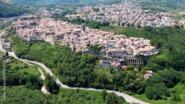 Fototapeta Aerial view of Sant'Agata dei Goti city in South Italy surrounded of Mountains and gree vegetation on Summer light