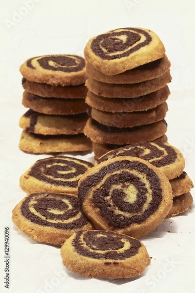 Obraz Chocolate Vanilla Swirl Cookies Stacks on Parchment