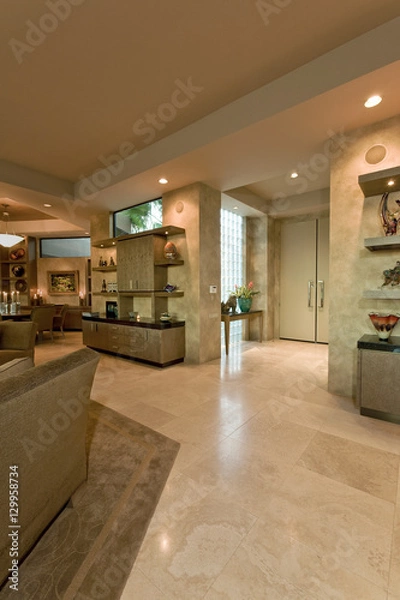 Fototapeta View of a luxury living room wit dining area in the background at home