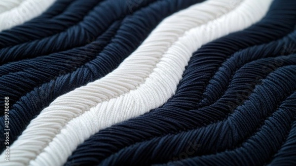 Fototapeta Embroidered minimalist concept. A close-up of textured fabric featuring wavy stripes in dark navy and white tones, showcasing depth and intricacy in its design.