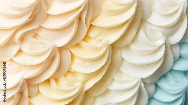 Fototapeta Creamy cake frosting texture with pastel colors, close-up for culinary and confectionery designs