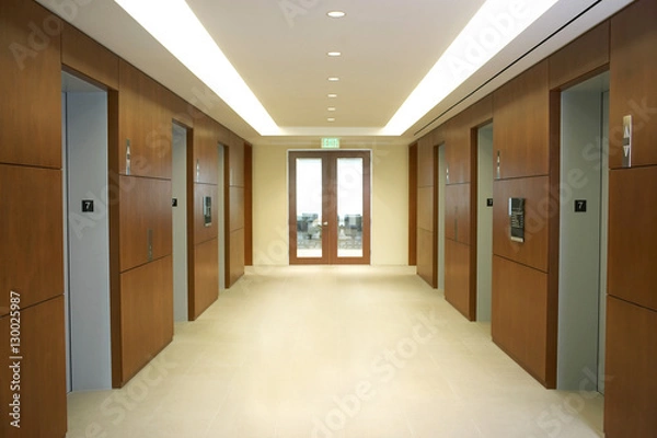 Fototapeta Empty hallway between elevators