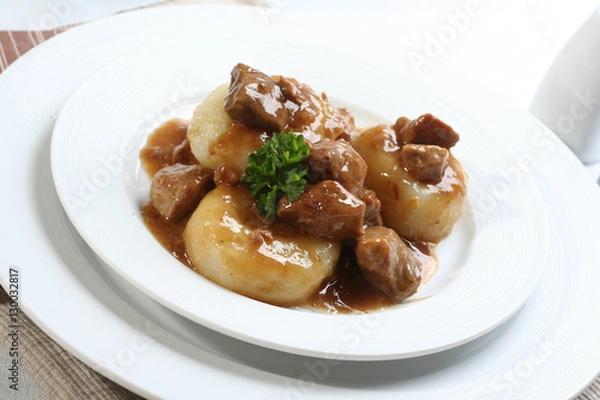 Fototapeta Silesian dumplings on white plate