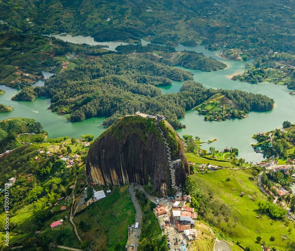 Fototapeta Aerial View of Guatape Rock Surrounded by Lush Greenery and Lakes in Guatape, Antioquia, Colombia
