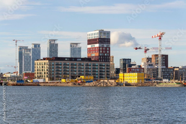 Obraz Residential development on Nihti island from sea port on sunny summer day on July 6, 2024 in Helsinki, Finland.