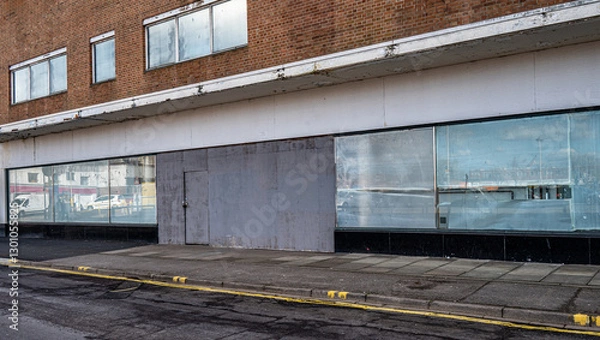 Obraz Closed and empty shops in a shopping centre depicting the dying UK high street.