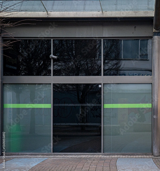 Fototapeta Closed and empty shops in a shopping centre depicting the dying UK high street.