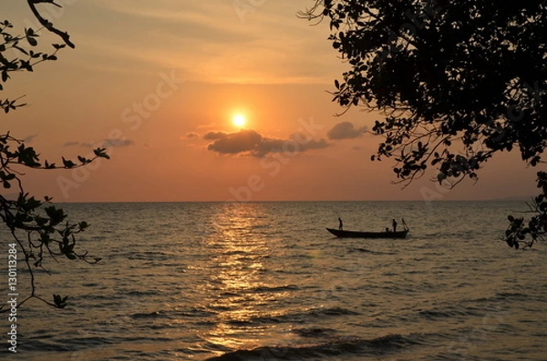 Obraz Kep,Cambodia. Fishing boat returns at sunset