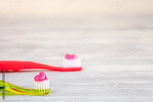 Fototapeta prevention and care children's teeth wooden background top view