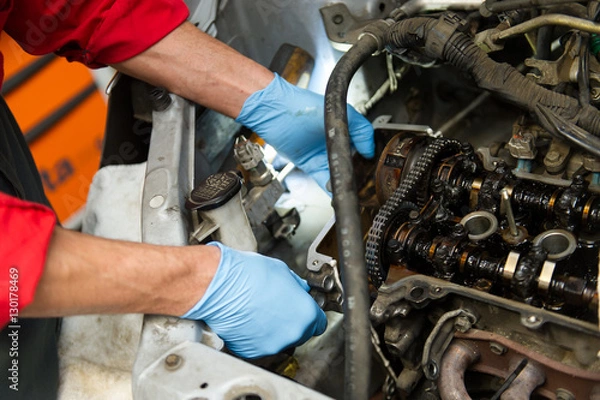 Obraz Mechanic fixing a car's engine 
