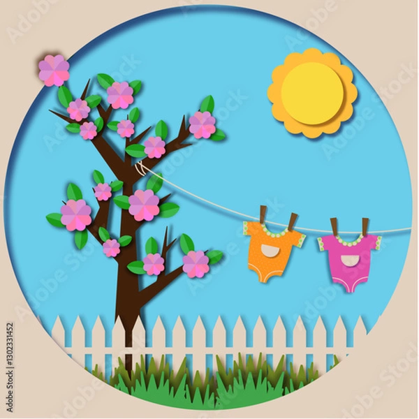 Obraz a tree with children's clothes hanging from it