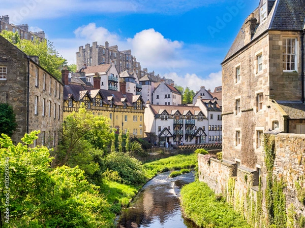 Fototapeta Edinburgh, Scotland, Dean Village and the Water of Leith on a beautiful spring day. A great draw for tourists.