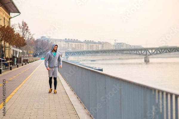Fototapeta Young man running