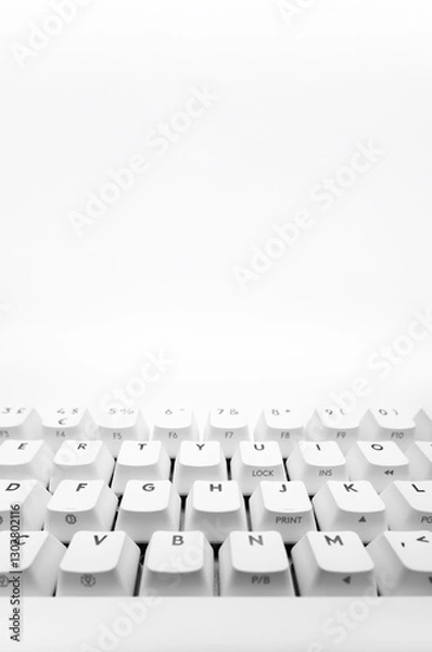 Fototapeta White, wireless gaming mechanical computer  keyboard closeup. Minimal, modern design on white background. Front view.  60 percent keyboard. copy space.