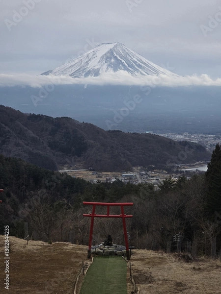 Obraz scenic view of Mount Fuji with traditional red torii gate in foreground, surrounded by nature and clouds, creating serene atmosphere