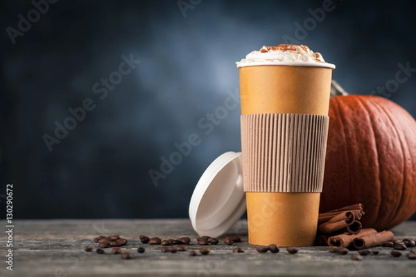 Fototapeta Pumpkin spice latte in a paper cup