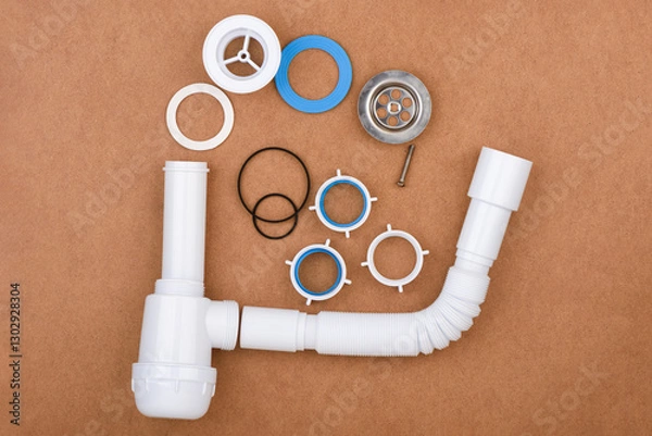 Fototapeta Completely disassembled complete sink drain assembly kit with flexible tube and accessories.