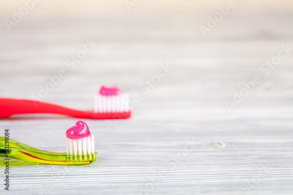 Fototapeta children's toothbrush oral care on wooden background