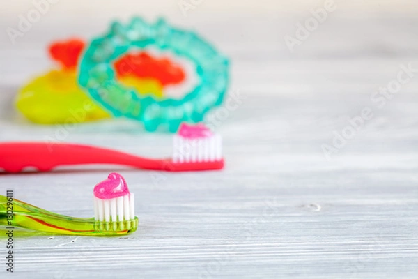 Fototapeta prevention and care children's teeth wooden background top view