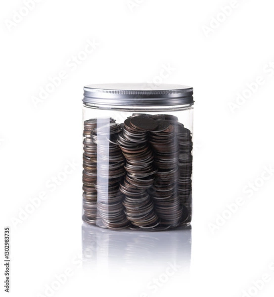 Fototapeta Coins in jar isolated with white background