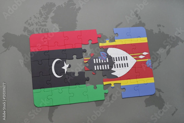 Fototapeta puzzle with the national flag of libya and swaziland on a world map