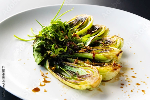 Obraz Fresh bok choy is elegantly plated, showcasing a vibrant green garnish inspired by Asian cuisine.