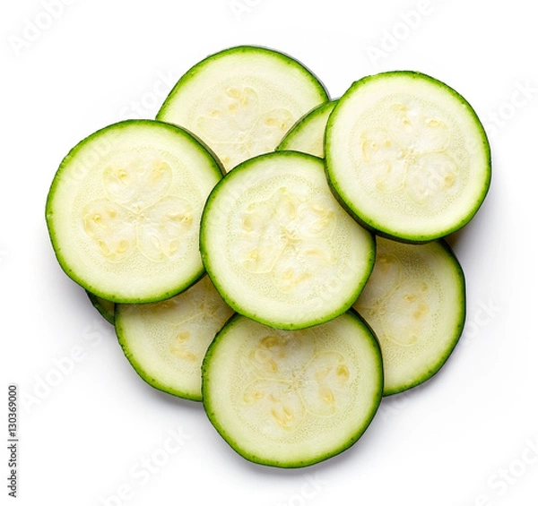 Fototapeta Zucchini slices isolated on white, from above