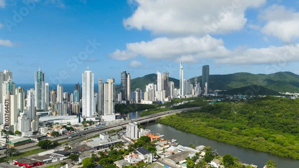 Fototapeta Close-up view of Barra Sul in Balneário Camboriú, Brazil, featuring the famous BR-101 highway that runs along the entire Brazilian coastline.