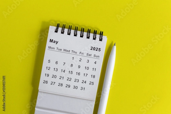 Fototapeta Hello, May 2025 desk calendar for planning on yellow background.