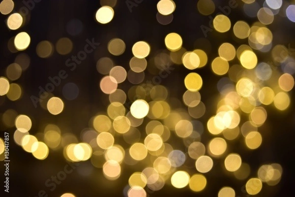 Fototapeta Glittering bokeh circular gold on black  background .