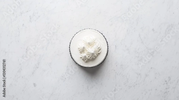 Fototapeta A top-down view of a decorated cake on a marble surface,
