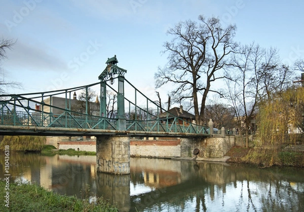 Fototapeta Green Bridge over Mlynowka channel in Opole. Poland