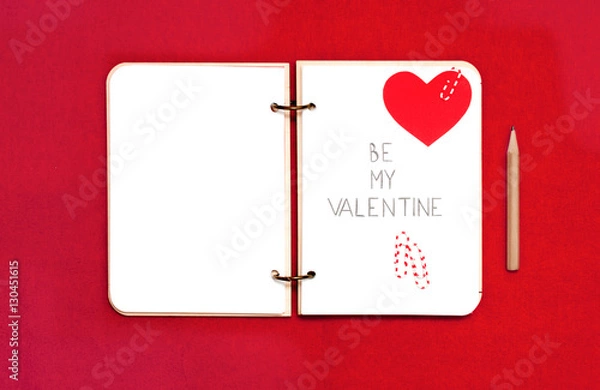 Obraz Opened blank notepad on red background. Valentine's hart