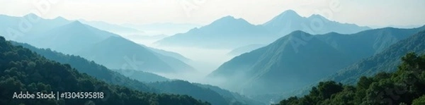 Fototapeta Jagged mountaintops shrouded in ethereal mist, dense vegetation below , Misty mountains, Central America, stone