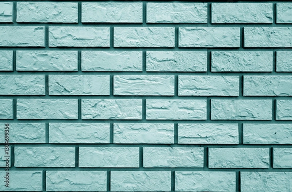 Fototapeta Decorative cyan toned brick wall texture and pattern.
