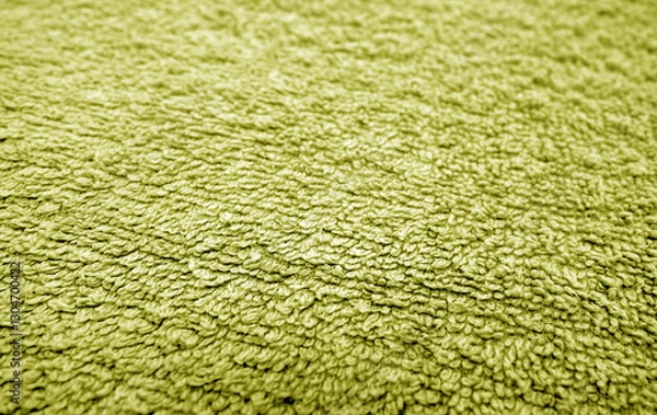 Fototapeta Yellow bath towel surface and texture close up with blur effect.