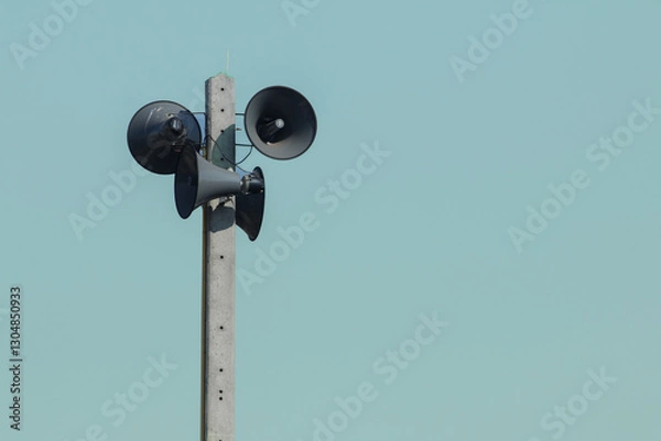 Fototapeta Vintage style amplifier installed on the electric pole wirelessly. The speaker receives waves and distributes sound signals for communication and public relations.