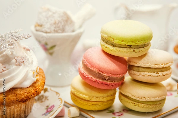 Fototapeta Winter table appointments with macaroons and sweets