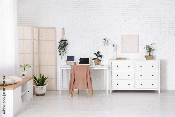 Fototapeta Interior of office with workplace, folding screen and commode