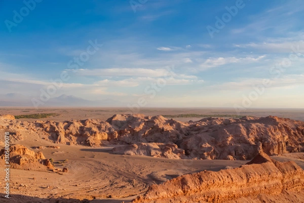 Fototapeta Moon valley famous desert landscape in Chile. Atacama desert tourist sight Valle de la Luna with stunning dry soil arid landscape of red rocks and sand under blue sky  on Altiplano high altitude plain