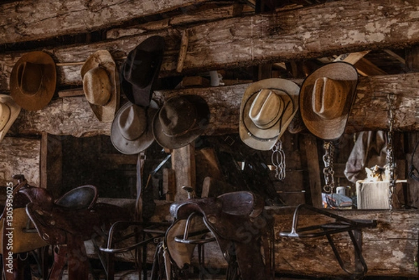 Obraz Cowboy hats on wall in rustic tack room