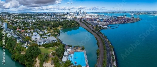 Fototapeta Panoramic aerial view of Auckland, New Zealand. Cityscape, harbor, and swimming pool visible. Shipping containers and city buildings are prominent. PARNELL, AUCKLAND, NEW ZEALAND