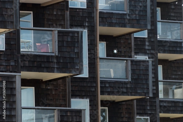 Obraz Condo building numerous balconies on the wall covered by cedar planks