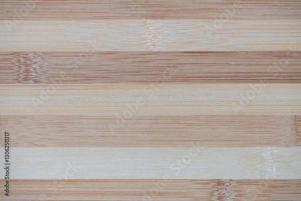Fototapeta Bamboo board striped texture close-up. Surface of flat bamboo board composed of alternating planks of of light and dark tones, pattern, background, high resolution.