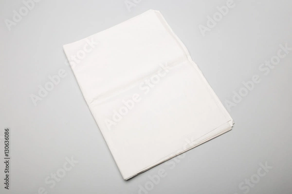 Obraz Folded newspapers on gray background