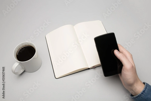 Fototapeta Notebook with mobile device and coffee